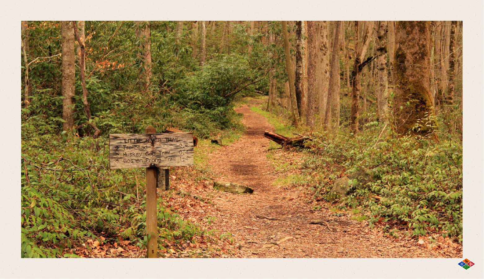 Sign on the Little River Trail showing how far ahead the Trailhead, Huskey Gap Trail, and Goshen Prong Trail are