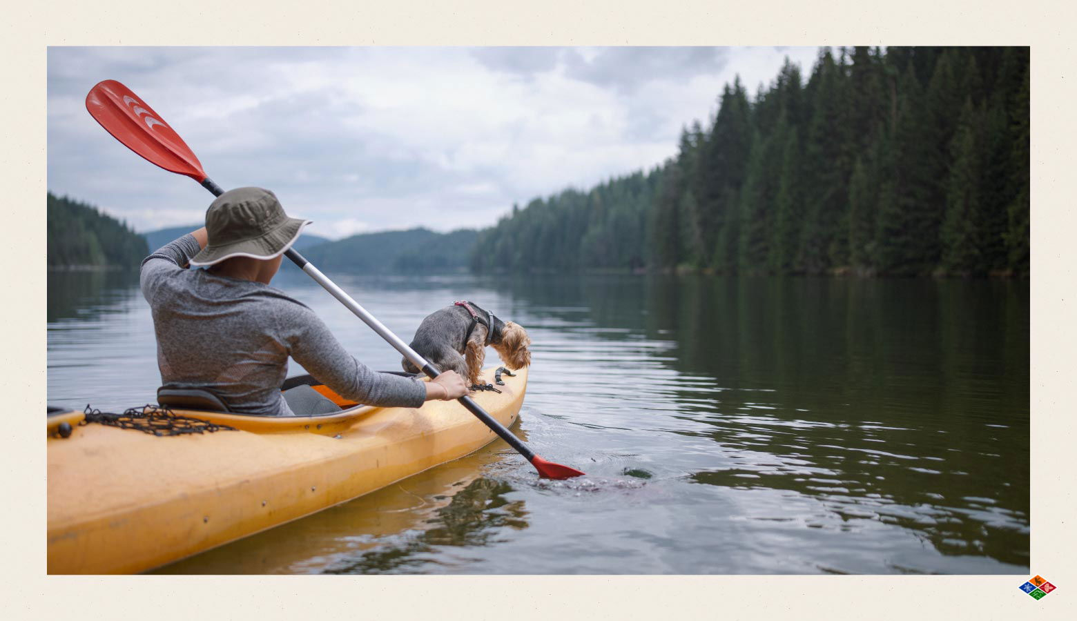 Photo of a man kayaking with their dog in the Smoky Mountains