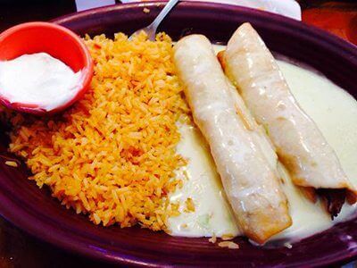 https://cdn.elkspringsresort.com/wp-content/uploads/2016/03/villa-zapata-mexican-chimichangas.jpg