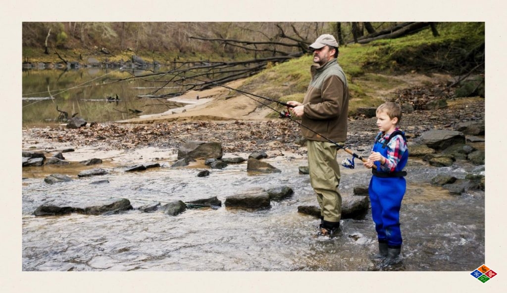 A father and son fishing while vacationing in the Smoky Mountains. 