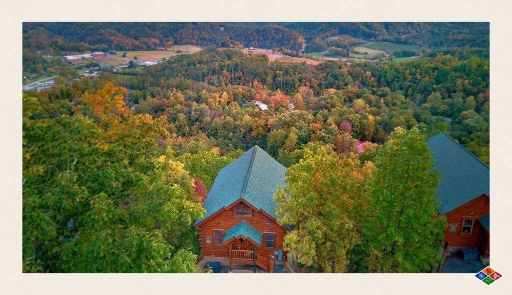 A photo of Elk Springs Resorts cabins in Sevierville, TN, that are surrounded by foliage changing colors. 