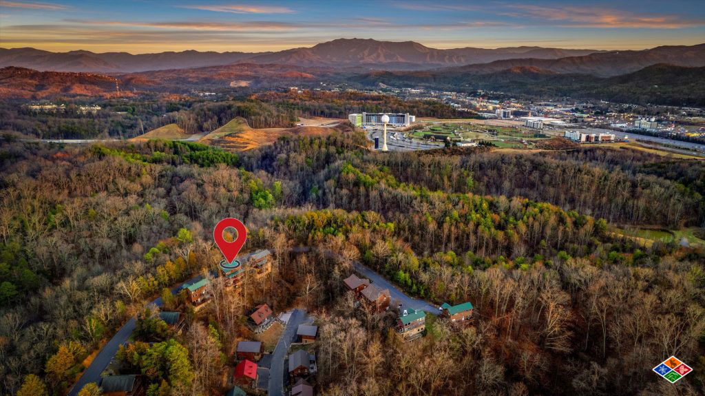Drone view of cabin in Gatlinburg with Mt LeConte in the background
