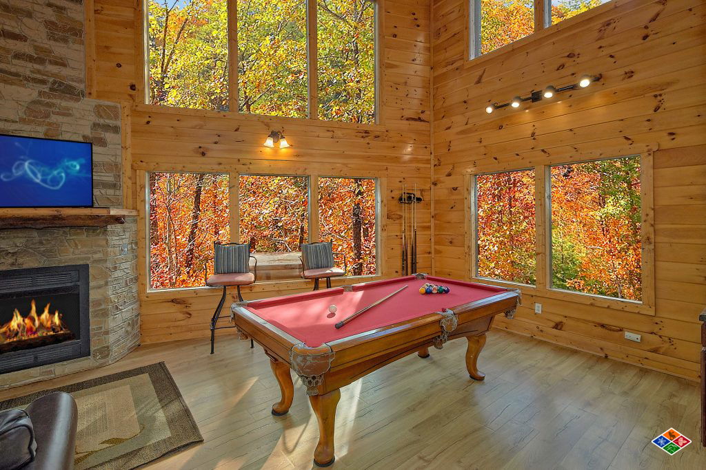 cabin game room with pool table and foosball